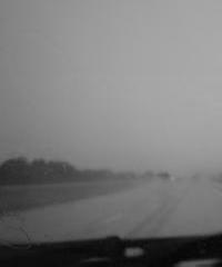 the road through a thunderstorm.